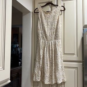 Beautiful white and cream lace dress with fully lined cream undergarment